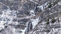 Panorama Provo Canyon in Utah with snowy precipitous slopes under cloudy sky in winter