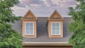 Panorama Puffy clouds at sunset Roof of a house with two gabled dormer windows at Utah Royalty Free Stock Photo