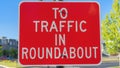 Panorama Red roadsign with white To traffic in roundabout at Daybreak in South Jordan, Utah Royalty Free Stock Photo