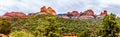 Panorama of the red rocks of Schnebly Hill and other red rocks at the Oak Creek Canyon viewed from Midgely Bridge Royalty Free Stock Photo