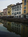 Panorama reflection of historic buildings in Naviglio Grande Pavese water canal in Milan Lombardy Italy Europe
