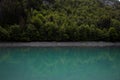 Panorama reflection of turquoise bright blue colored alpine mountain lake reservoir Mapragg Mapraggsee in Switzerland Royalty Free Stock Photo