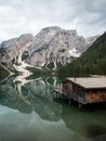 Panorama reflection boat house of Lago di Braies Pragser Wildsee alpine mountain lake Dolomites alps South Tyrol Italy Royalty Free Stock Photo