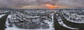 Panorama of Regensburg city in Bavaria with the river Danube the cathedral and the stone bridge in winter with ice and snow at sun