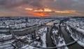 Panorama of Regensburg city in Bavaria with the river Danube the cathedral and the stone bridge in winter with ice and snow at sun