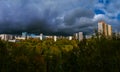 Panorama of residential disctrict of Moscow at autumn with beautiful dark rainy clouds in the blue sky Royalty Free Stock Photo