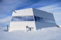 Panorama restaurant on Weisshorn summit, in Winter, a modern looking building in the Swiss Alps. Arosa, Switzerland. Royalty Free Stock Photo