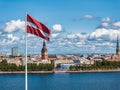 Panorama of Riga city with a big Latvian flag in foreground Royalty Free Stock Photo