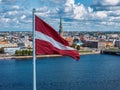 Panorama of Riga city with a big Latvian flag in foreground Royalty Free Stock Photo