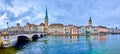 Panorama of the riverside housing of Limmat river with Peterskirche and Fraumunster churches, Zurich, Switzerland