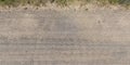 panorama of road from above on surface of gravel road with car tire tracks in countryside Royalty Free Stock Photo