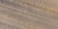 panorama of road from above on surface of gravel road with car tire tracks in countryside Royalty Free Stock Photo