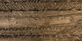 Panorama of road from above on surface of gravel road with car tire tracks Royalty Free Stock Photo