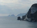 Panorama of rocks in a silvery sea to Ponza in Italy.