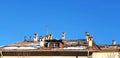 Panorama of the roof of the house with chimneys against the blue sky. Royalty Free Stock Photo