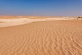 Panorama of the Rub Al Khali desert with red zig-zag sand and white limestone formations Royalty Free Stock Photo