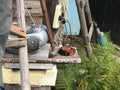 Panorama of rural life. wooden staircase, homemade. against the background of a tape recorder, a wooden bench, a construction tool Royalty Free Stock Photo