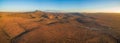 Panorama of rural road passing through Martian landscape. Royalty Free Stock Photo