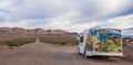 Panorama of an RV at a gravel road in Death Valley