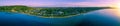 Panorama of Safety Beach Suburb coastline at sunset.