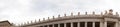 Panorama of saint peters basilica colonnade with statues standing on columns Royalty Free Stock Photo