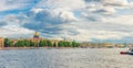 Panorama of Saint Petersburg city with row of old buildings on embankment of Neva river Royalty Free Stock Photo