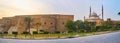 Panorama of Saladin Citadel with preserved medieval wall, huge towers, rising Alabaster mosque and ornamental garden around the Royalty Free Stock Photo