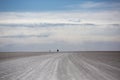 Panorama of the Salar of Uyuni with silhouette of 4x4 cars, Boli Royalty Free Stock Photo