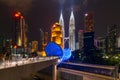 Panorama of Saloma link bridge in blue against a pure dark sky of the Kuala Lumpur late night and cityscape Royalty Free Stock Photo