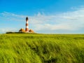 Panorama salt marshes with lighthouse Westerhever