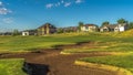 Panorama Sand bunker and fairway of a golf course with residential area in the background