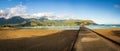 Panorama of the sandy beach and Hanalei Pier at sunrise Royalty Free Stock Photo