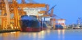 panorama scene of ship yard with heavy crane in beautiful twilight use for import export industry and international world trading