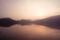 Panorama scenic of mountain lake with perfect reflection at sunrise Royalty Free Stock Photo