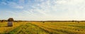 Panorama of scenic view of hay stacks at fall Royalty Free Stock Photo