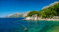 Panorama of the sea coast of Croatia. Brela. Makarska Riviera. Beach and Adriatic Sea. Summer season for vacation and recreation.