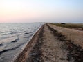 Amazing natural pictures of the sunset over the water mirror of the salt lake Sivash. Royalty Free Stock Photo