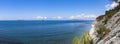 Panorama of the sea coast and wild beach at the foot of the rocks in the vicinity of the resort of Gelendzhik Royalty Free Stock Photo