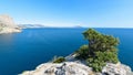 Panorama of the sea mountain coast, Crimea the Black Sea coast on a sunny day . rocks on the shore, blue sky Royalty Free Stock Photo