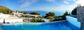 The panorama of sea view swimming pool in the luxury hotel