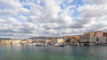 A panorama of the seaport town Chania, the island of Crete, Greece. A harbor with wooden pantons, moored yachts, ships, boats. Royalty Free Stock Photo