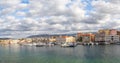 A panorama of the seaport town Chania, the island of Crete, Greece. A harbor with wooden pantons, moored yachts, ships, boats. Royalty Free Stock Photo