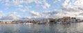 A panorama of the seaport town Chania, the island of Crete, Greece. A harbor with wooden pantons, moored yachts, ships, boats. Royalty Free Stock Photo