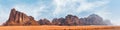 Panorama of Seven Pillars of Wisdom rock formation as seen from visitor centre in Wadi Rum protected desert, Jordan Royalty Free Stock Photo