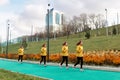 Panorama with several images of the same female jogger on a running track against a city background