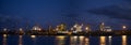 Panorama with ships and cranes near night pier Royalty Free Stock Photo