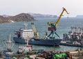 Panorama on ships at pier, port cranes on commercial seaport Petropavlovsk-Kamchatsky