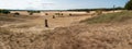 Panorama shot of sand plains and sand drifts with the name `Beekhuizerzand
