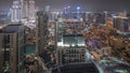 Panorama showing aerial view of a big futuristic city night timelapse. Business bay and Downtown