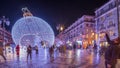 Panorama showing Christmas decorations with big ball on Luis De Camoes square night timelapse. Royalty Free Stock Photo